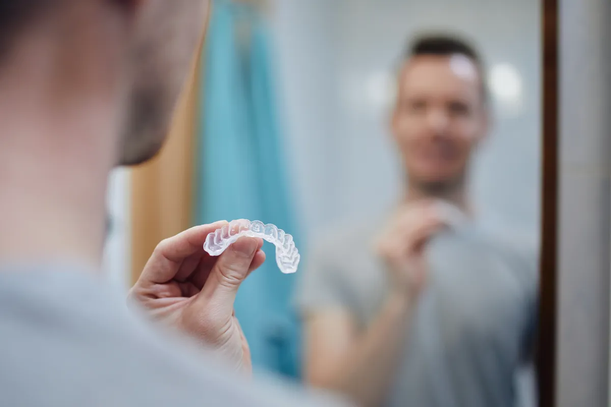 A patient discussing Invisalign treatment with their orthodontist