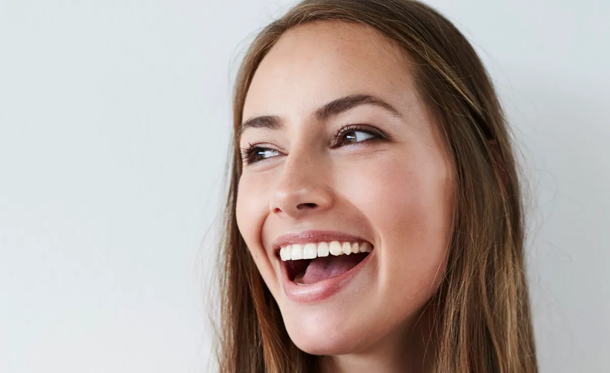 A patient smiling during a relaxed consultation with her orthodontist