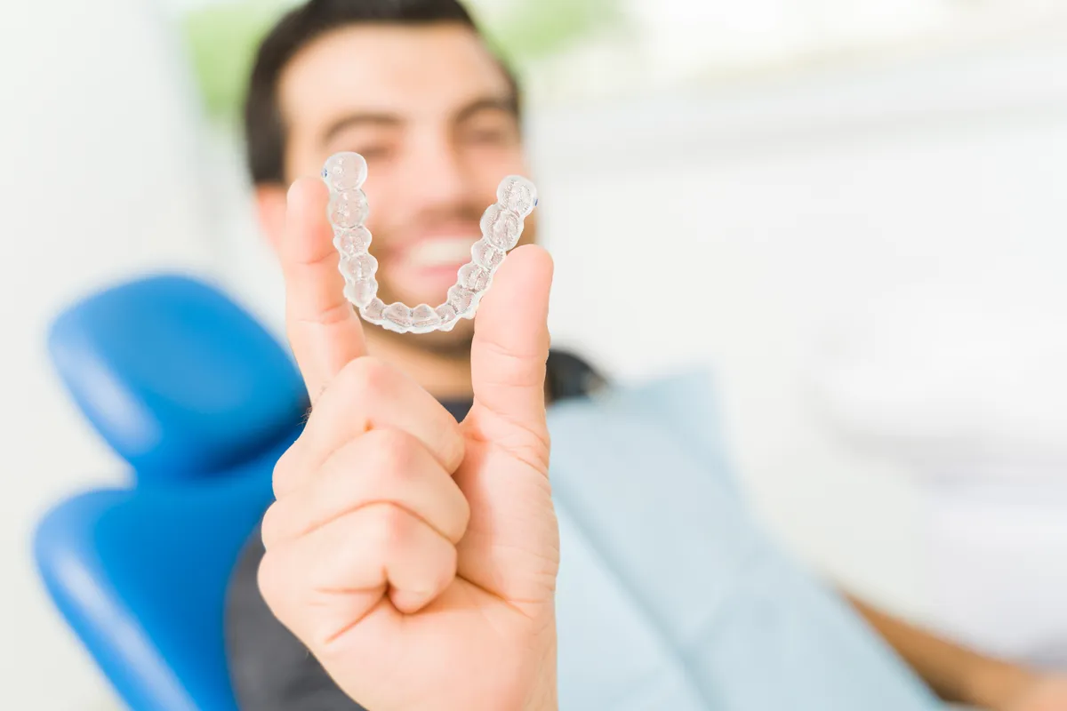 A patient at the end of Clarity™ Aligners treatment
