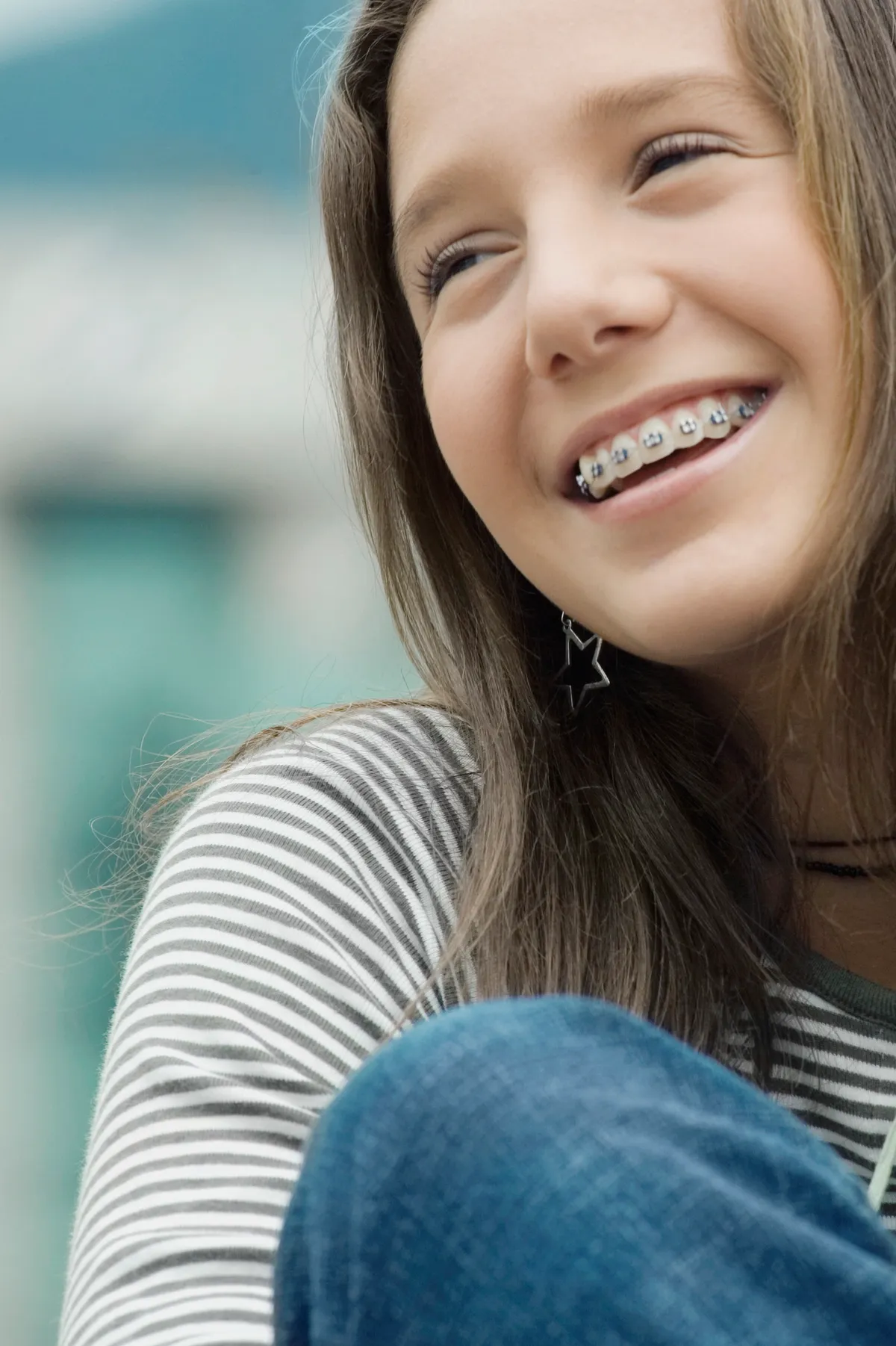 A teenager laughing with a friend